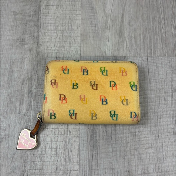 Dooney & Bourke Handbags - vintage Dooney & Bourke wallet with a yellow/cream